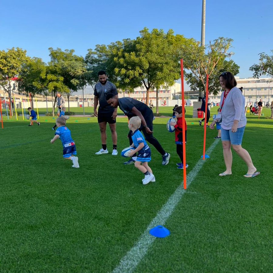 TJ coaching rugby tots in Dubai
